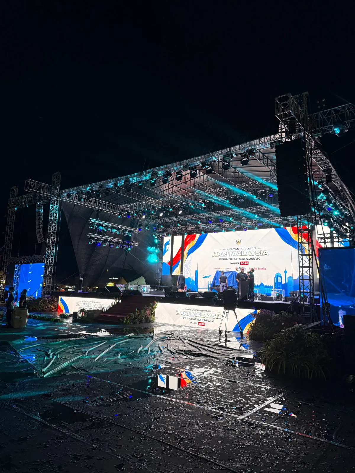 Outdoor stage production for the Hari Malaysia Peringkat Sarawak 2025 celebration at night